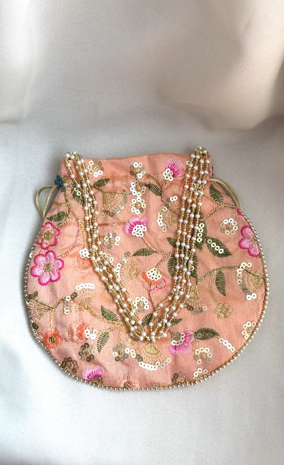 Potlis to Match Your Ethnic Wear (Beige) Potlis to Match Your Ethnic Wear (Beige)